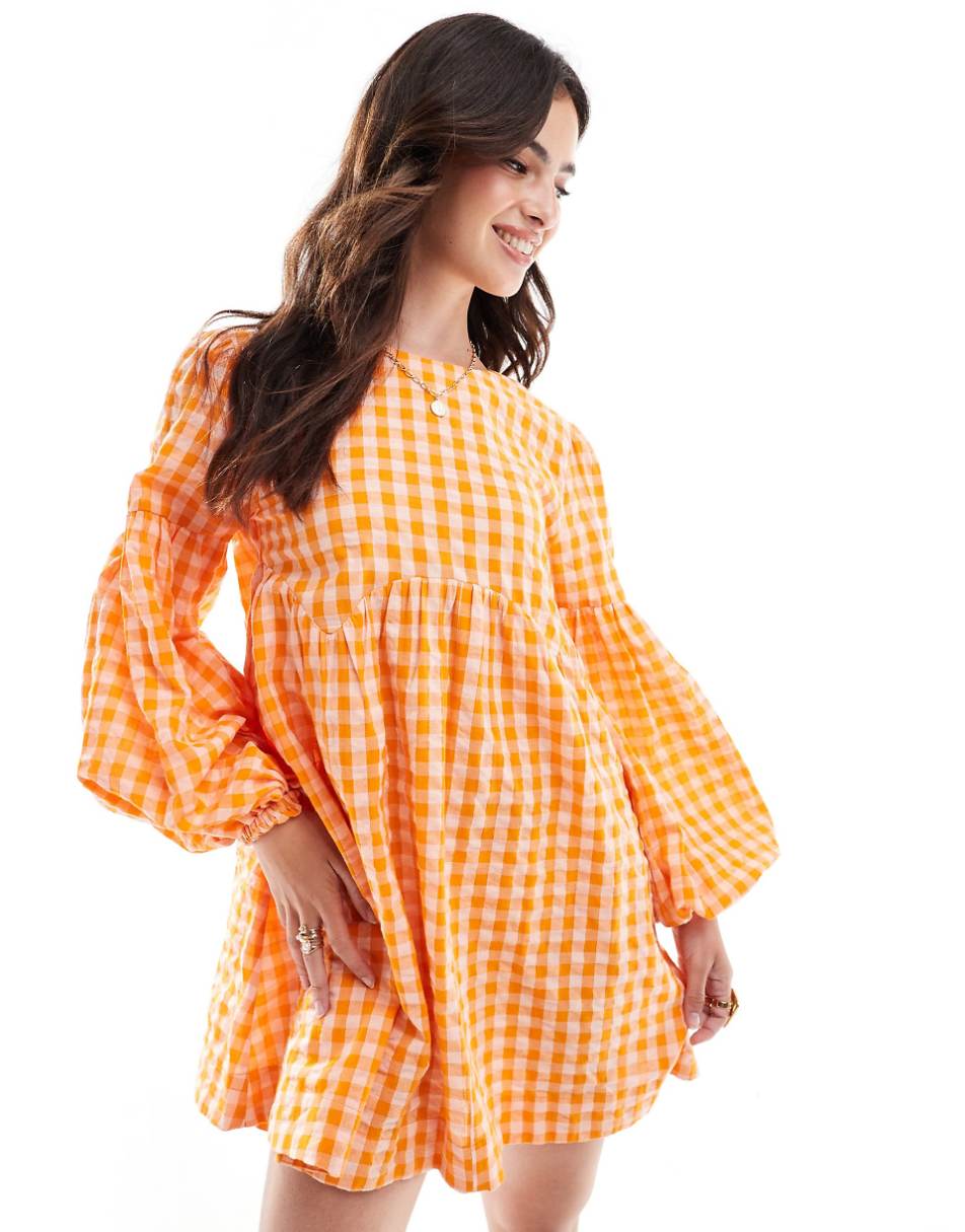 ASOS DESIGN mini textured smock dress in orange and pink gingham