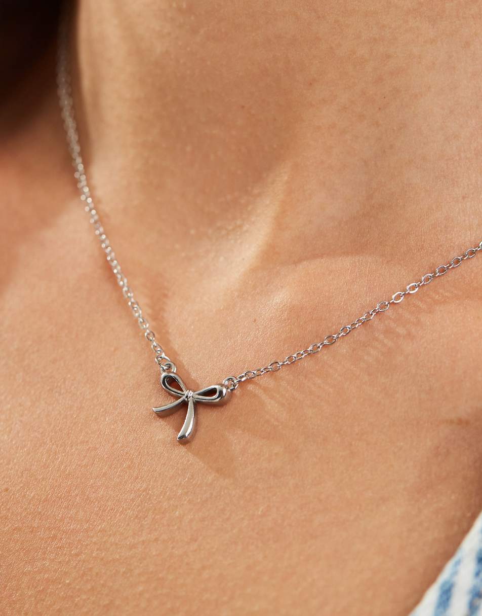 Lost Souls stainless steel bow pendant necklace in silver