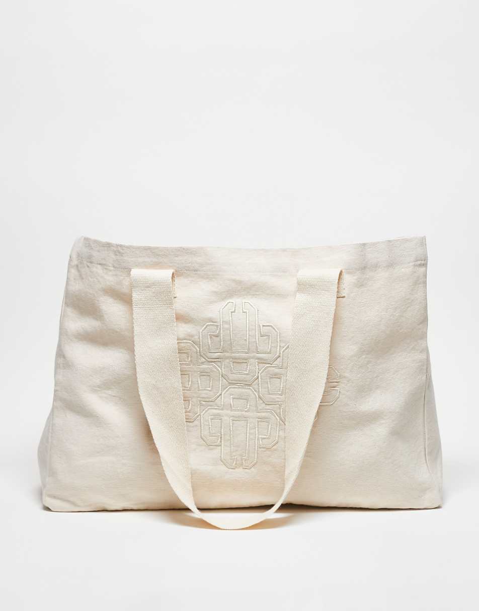 The Couture Club emblem logo tote bag in off white