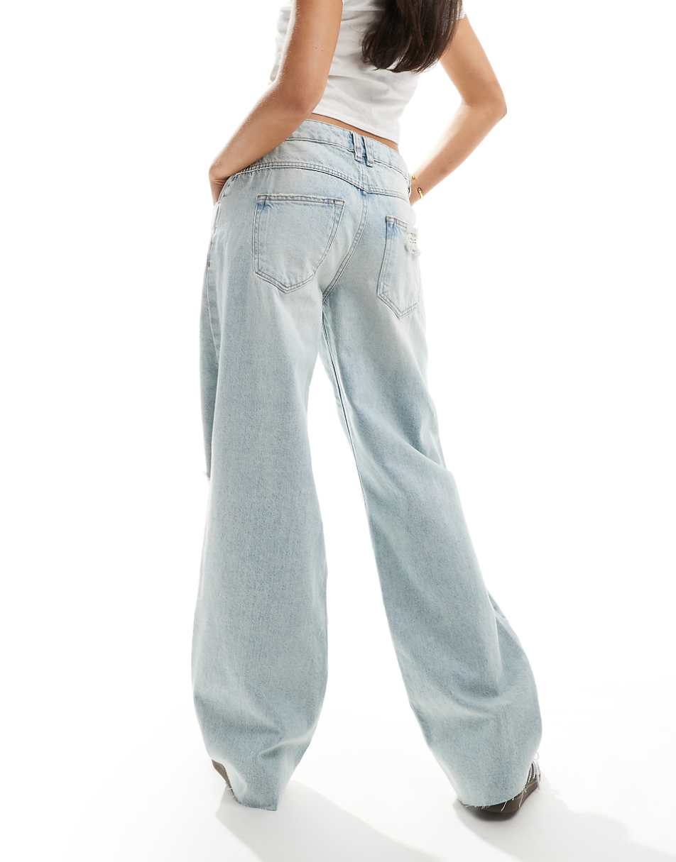 ASOS DESIGN mid rise baggy boyfriend jeans with rips in light wash