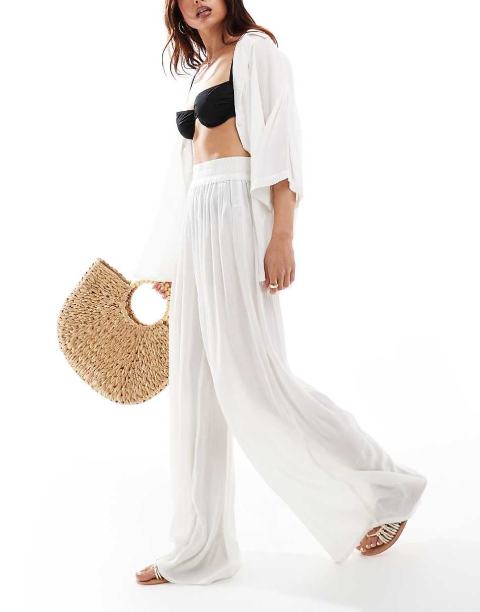 ASOS DESIGN Curve crinkle wide leg beach pants in white - part of a set