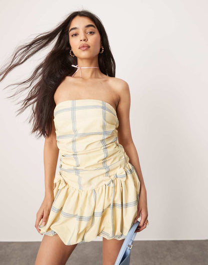 ASOS DESIGN ultimate bandeau mini puffball dress with bow skirt in yellow and blue check