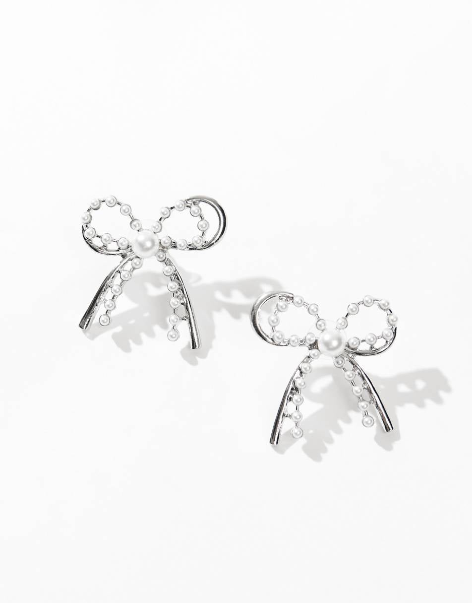 8 Other Reasons rhodium plated pearl embellished bow earrings in silver