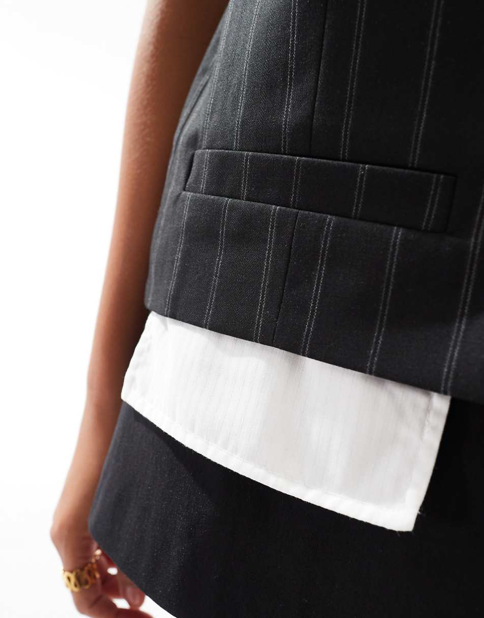 ASOS DESIGN Petite exposed pocket vest in black stripe