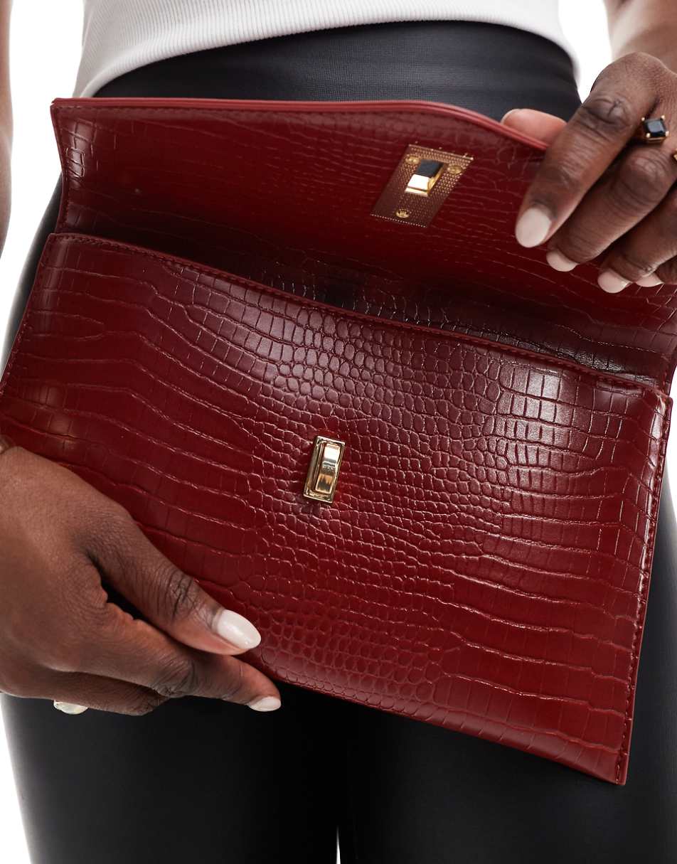 True Decadence classic clutch bag in deep red