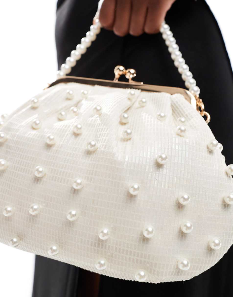 True Decadence pearl embellished bag with pearl handle in cream