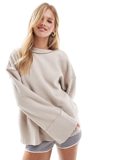 ASOS DESIGN supersoft exposed seam sweatshirt with deep cuffs in warm cream
