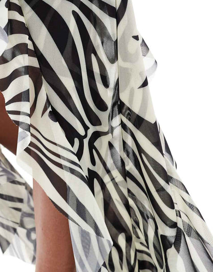 Murci Exclusive mesh halterneck keyhole detail high/low hem maxi dress in zebra print