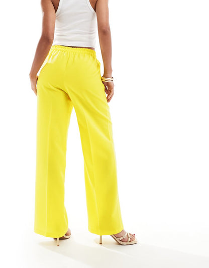 ASOS DESIGN tailored pull on pants in yellow