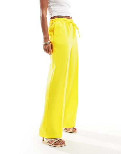 ASOS DESIGN tailored pull on pants in yellow