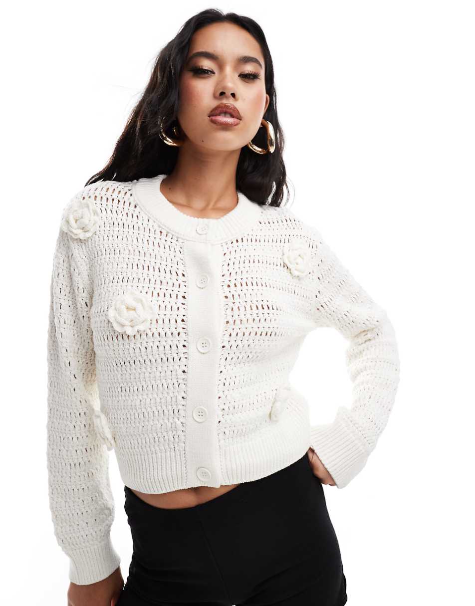 ASOS DESIGN knit crew neck cardigan in open stitch with crochet flower detail in cream