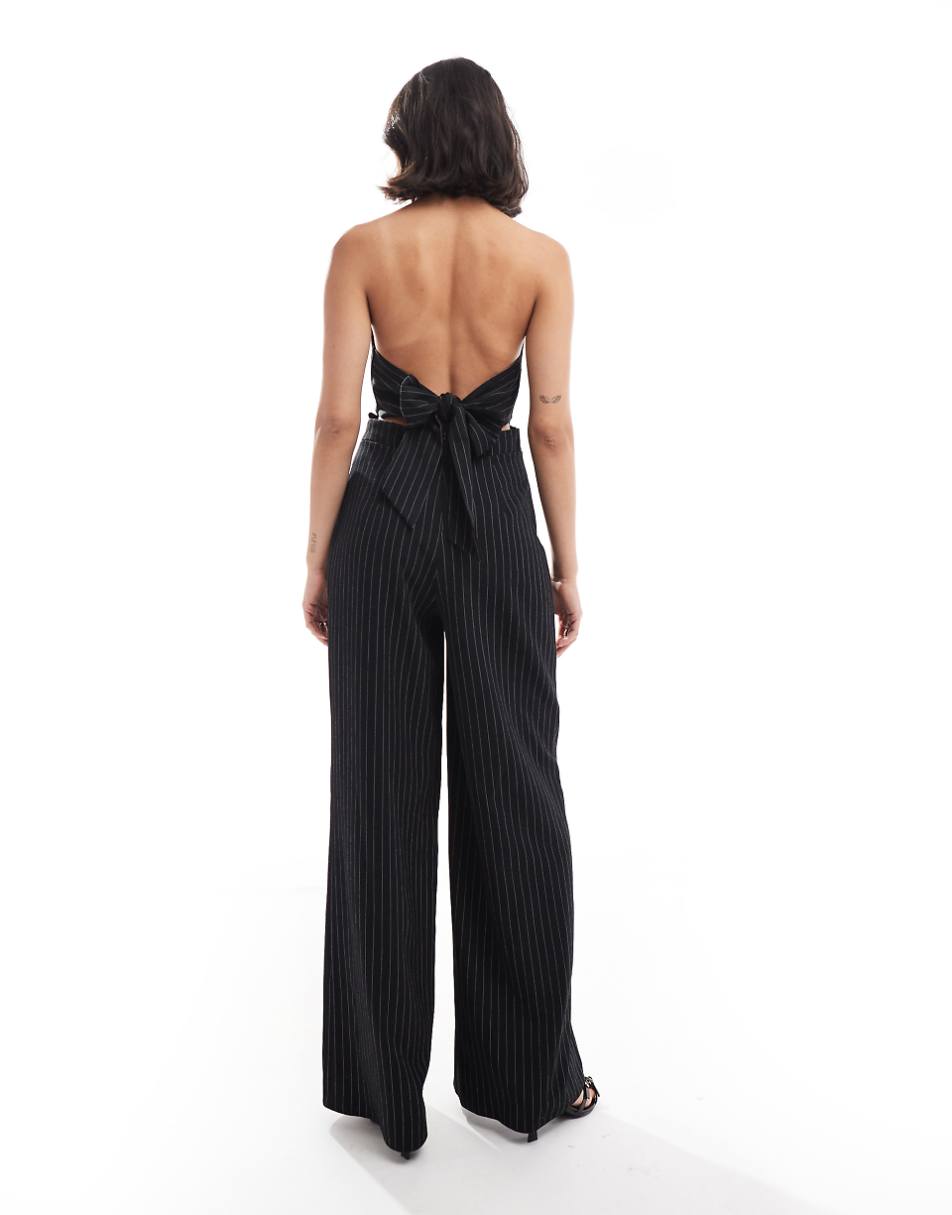 ASOS DESIGN halter tie up back jumpsuit in black and white stripe