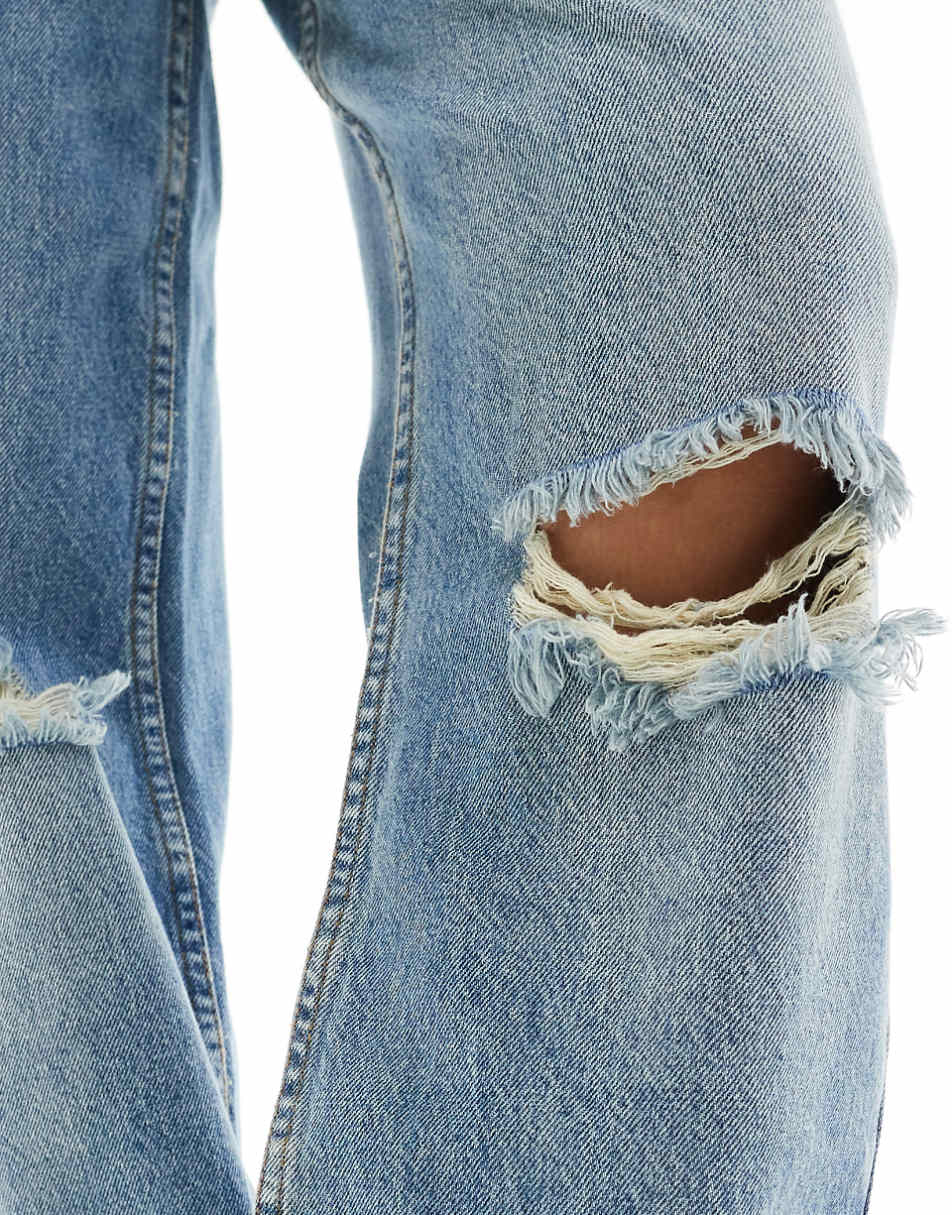 ASOS DESIGN mid rise baggy boyfriend jeans with rips in mid blue