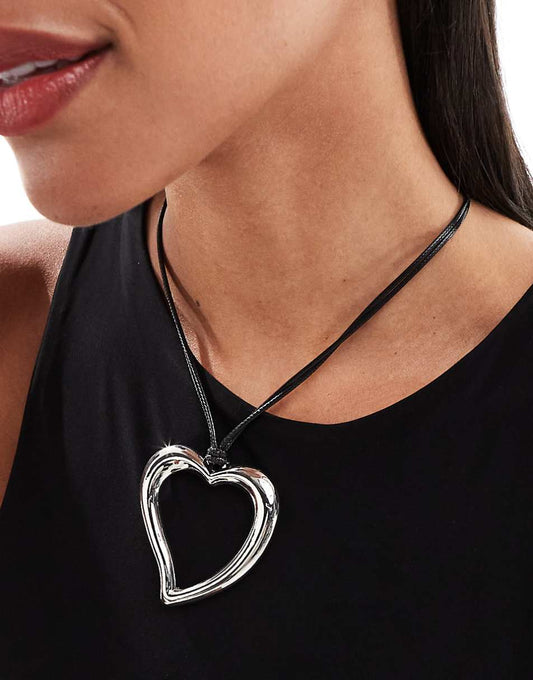 ASOS DESIGN necklace with cord detail and oversized heart in silver tone