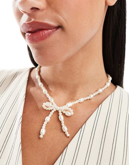 ASOS DESIGN necklace with faux freshwater pearl bow design