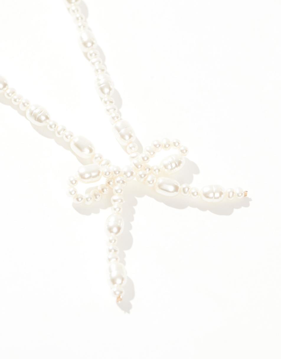 ASOS DESIGN necklace with faux freshwater pearl bow design