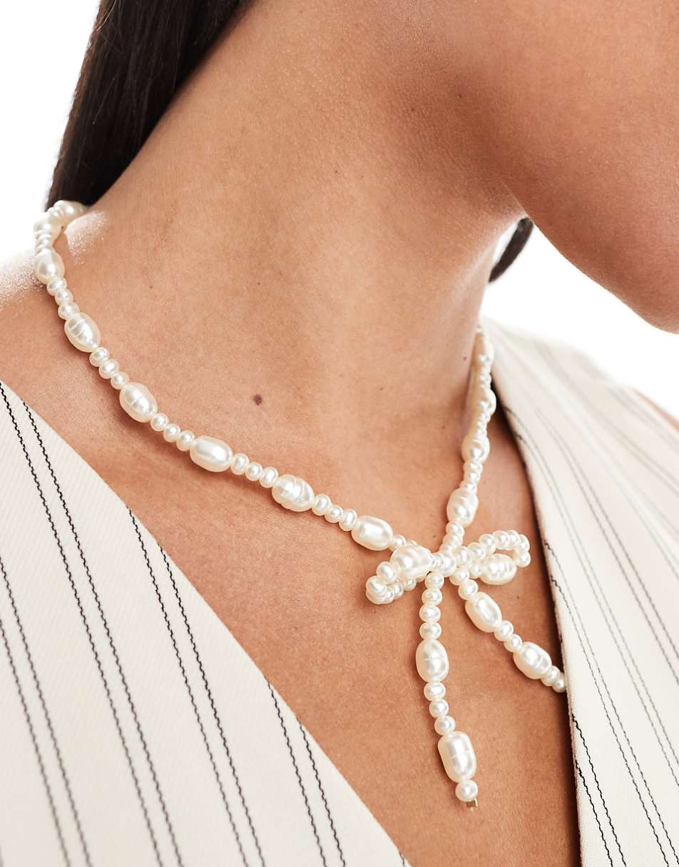 ASOS DESIGN necklace with faux freshwater pearl bow design