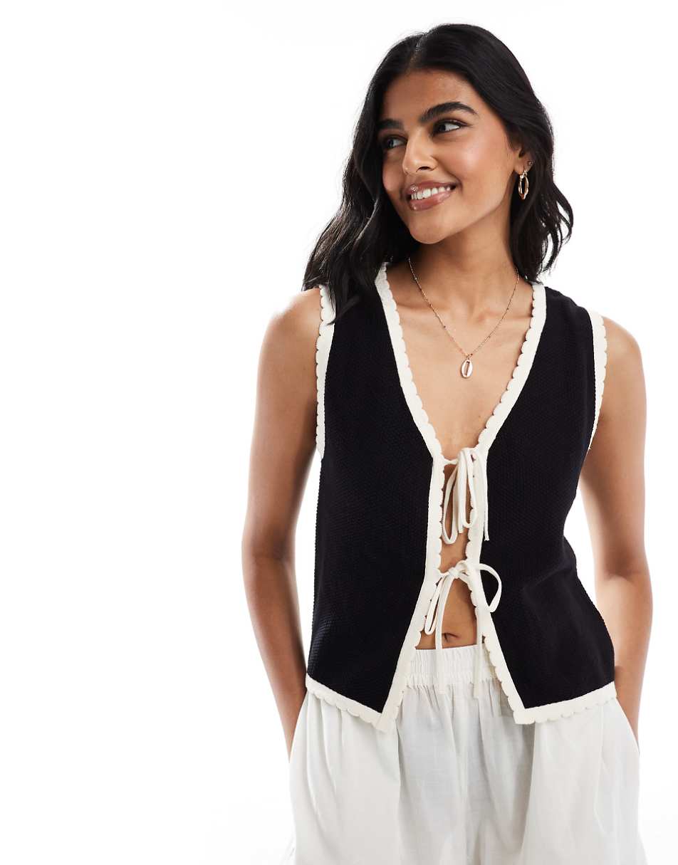 ASOS DESIGN knitted vest with contrast tipping in black and cream