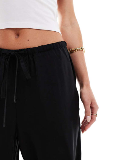 ASOS DESIGN Petite satin pull on pants in black
