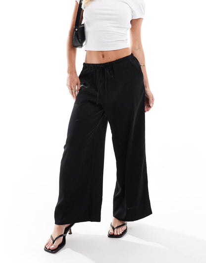 ASOS DESIGN Petite satin pull on pants in black