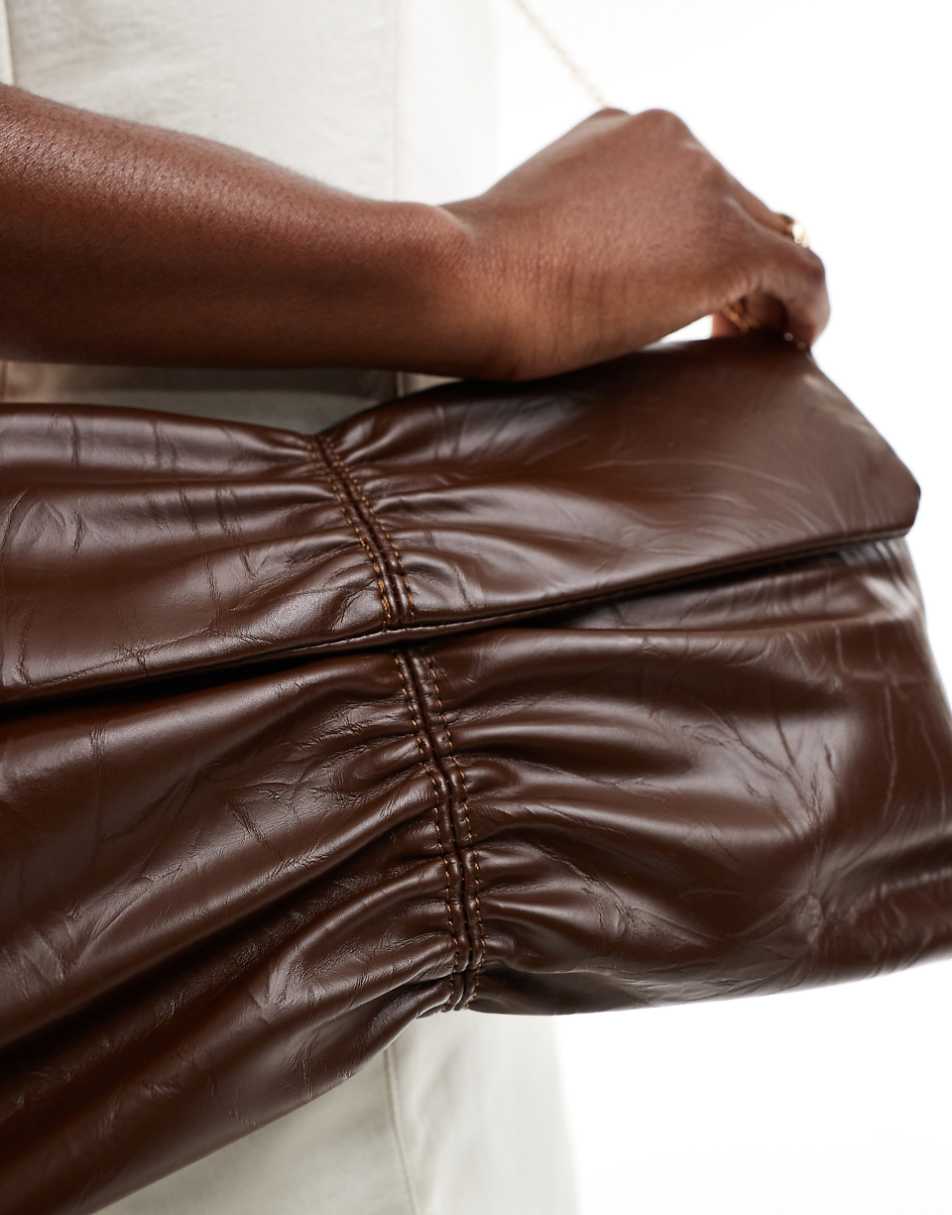 Glamorous rouched clutch bag in brown patent