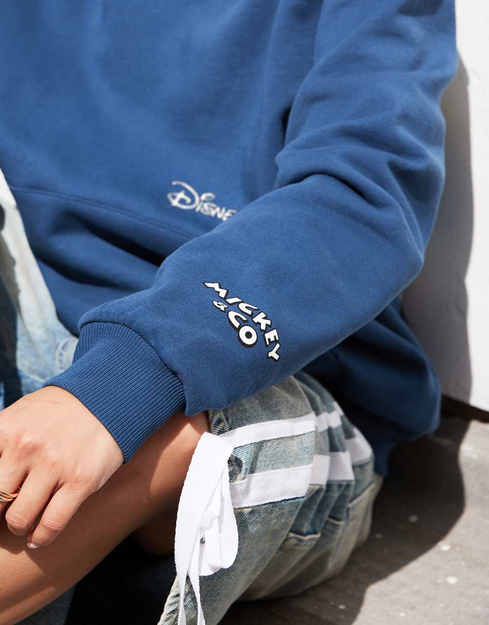 ASOS DESIGN Disney unisex oversized hoodie with Mickey Mouse & Friends prints in blue