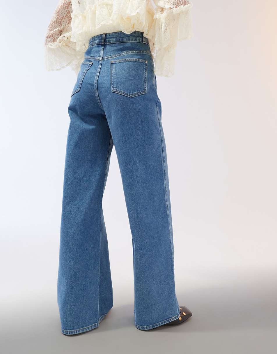 ASOS DESIGN clean wide leg jeans with front pockets in mid blue