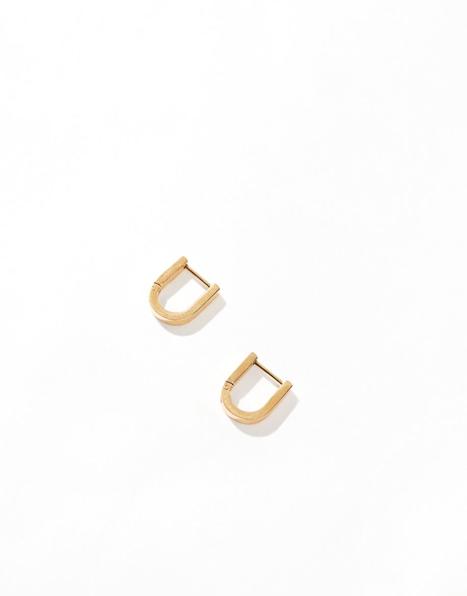 ASOS DESIGN waterproof stainless steel hoop earrings with oval clicker detail in gold tone