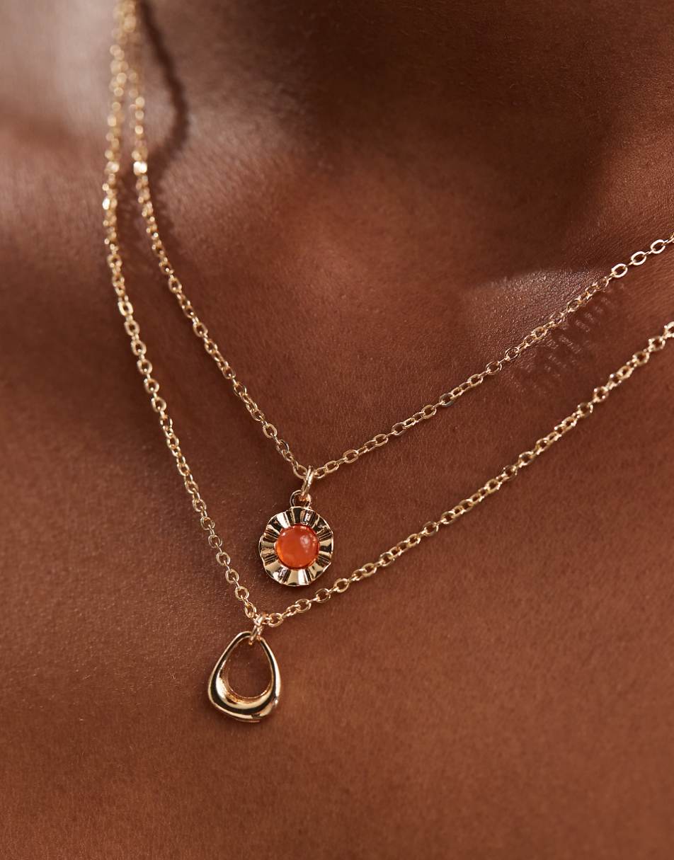 ASOS DESIGN 2-pack necklaces with red stone and circle design in gold tone