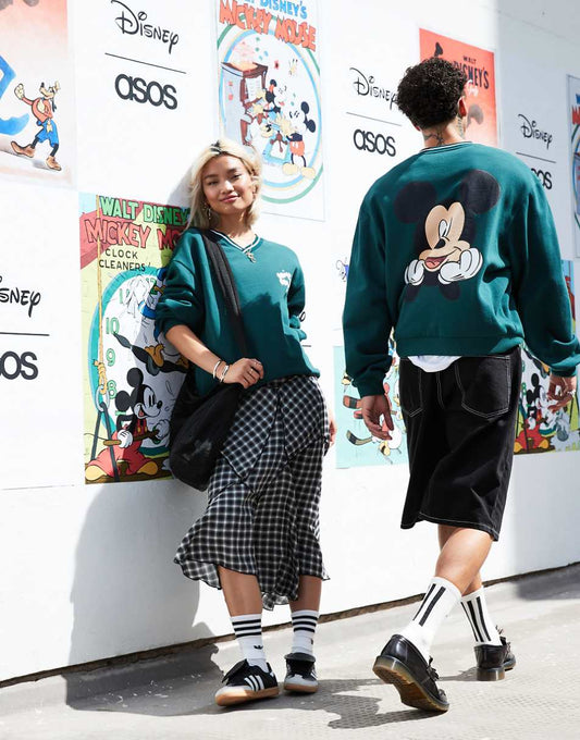 ASOS DESIGN Disney unisex boxy fit v neck sweatshirt with Mickey Mouse prints in green