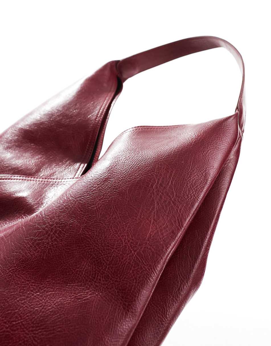 ASOS DESIGN slouch tote bag with crossover panel detail in burgundy