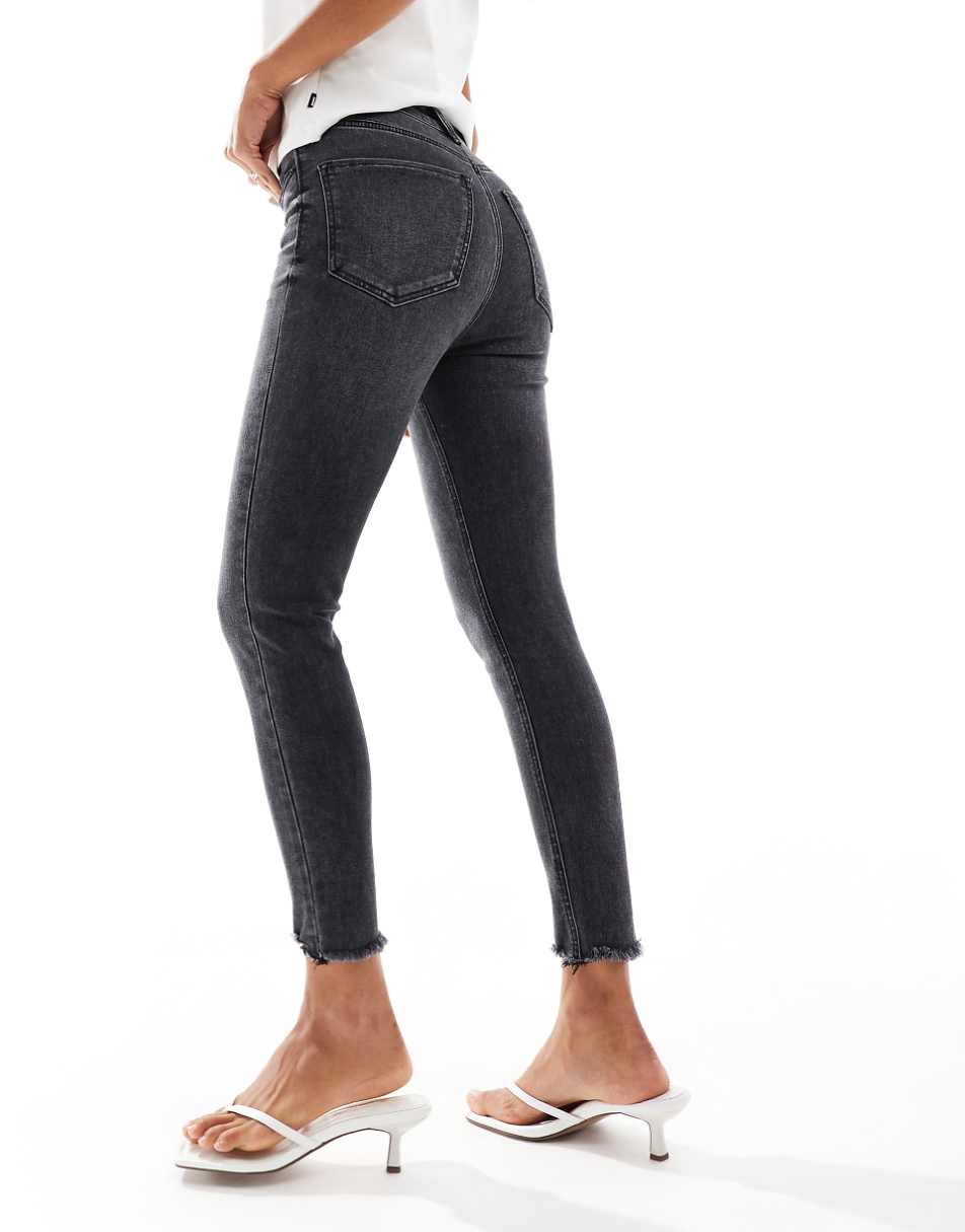 Stradivarius super skinny jeans with frayed hem in washed black