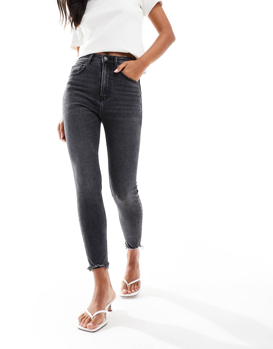 Stradivarius super skinny jeans with frayed hem in washed black