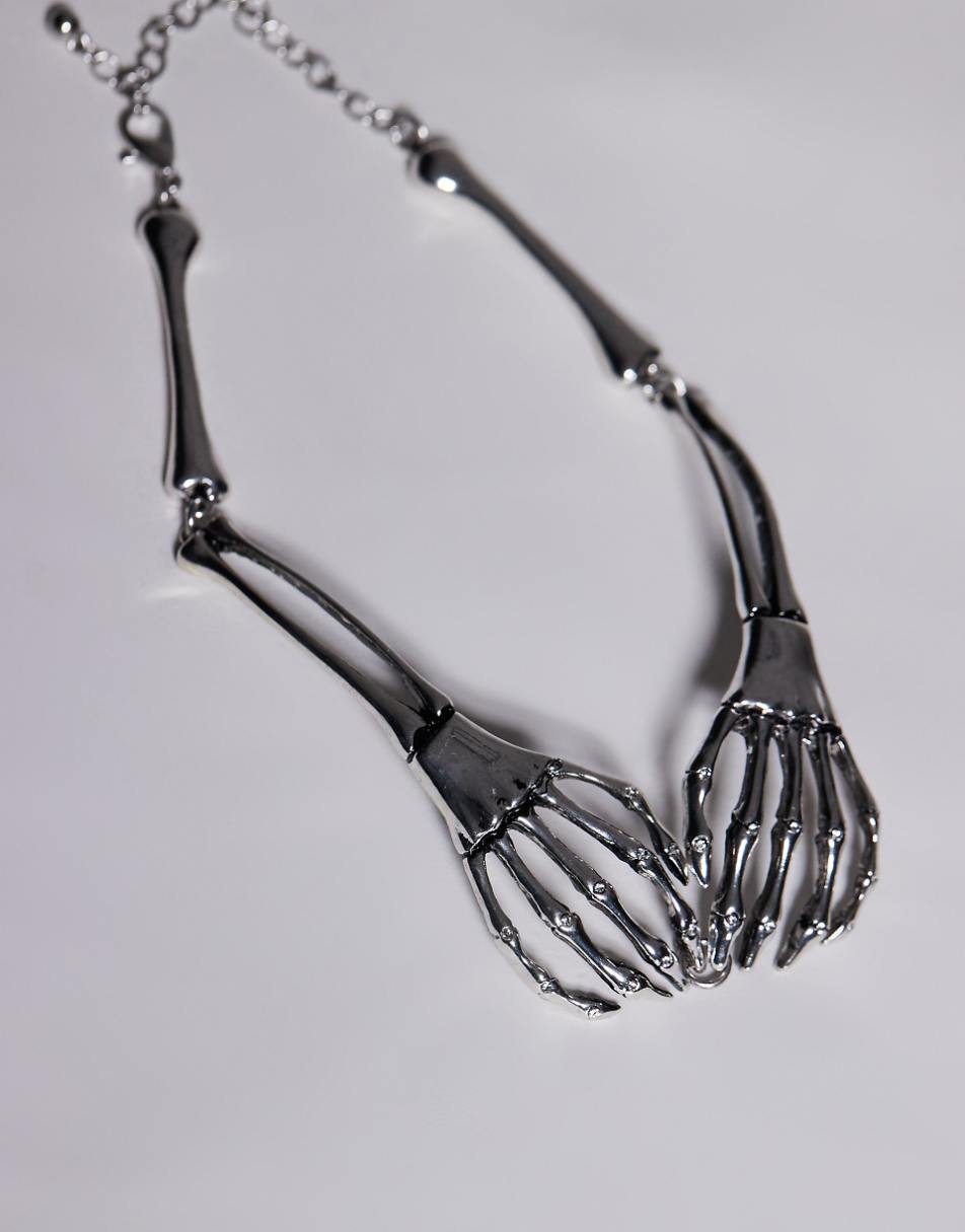 ASOS DESIGN Halloween choker necklace with skeleton hand design