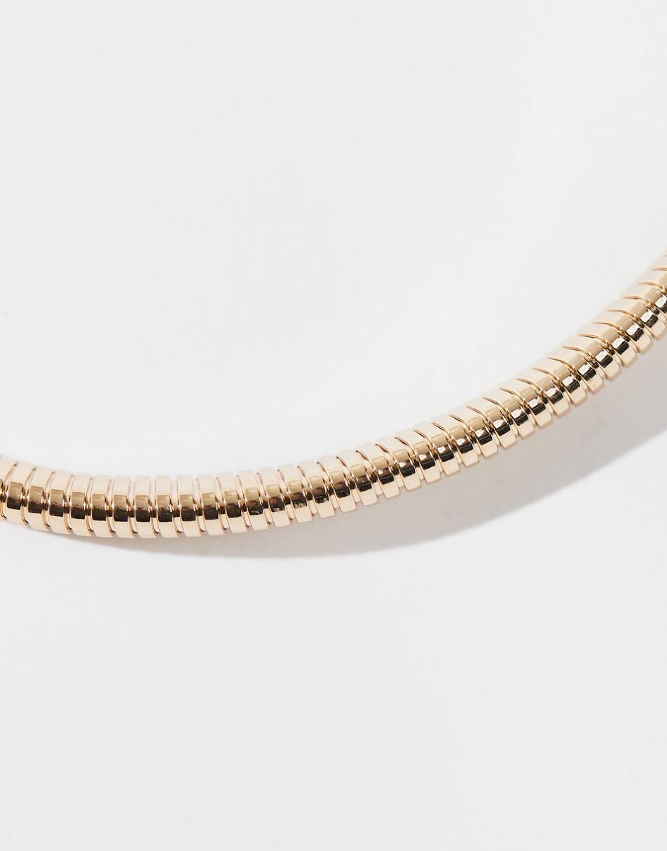 ASOS DESIGN torque choker with ribbed design in gold tone