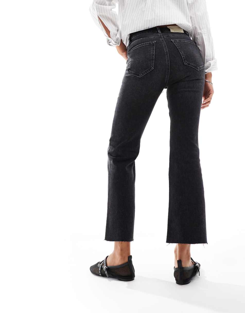 Stradivarius cropped flared jeans in black wash